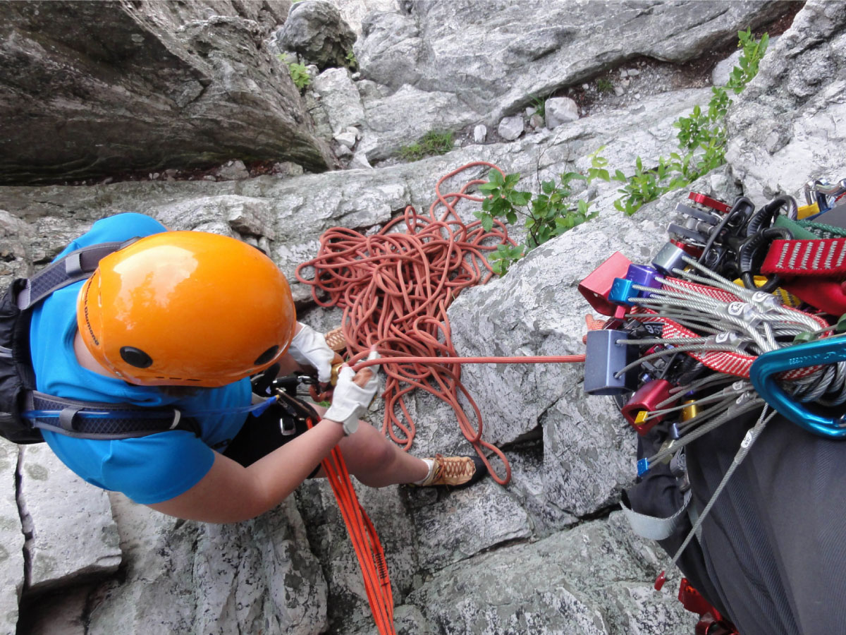 A beginner climber gets ready to descend