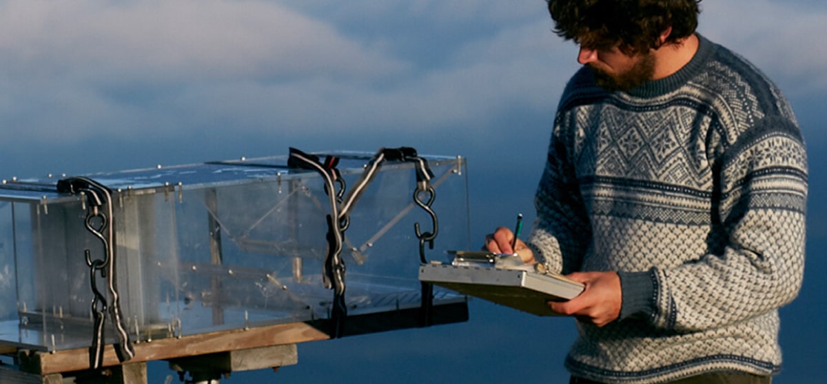 A science intern takes air samples