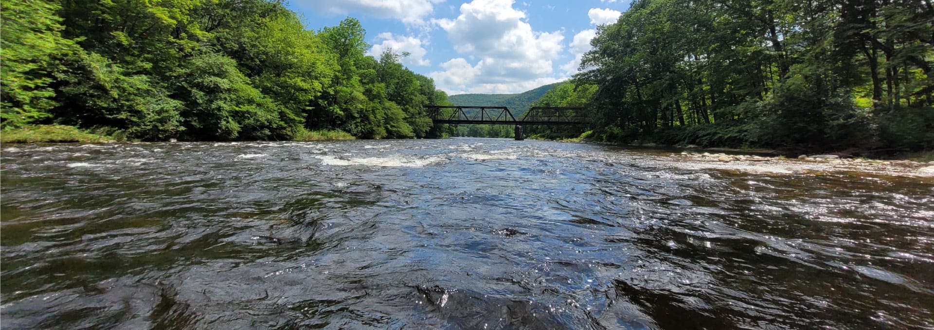 A view of the Deerfield River as it rushes under a bridge
