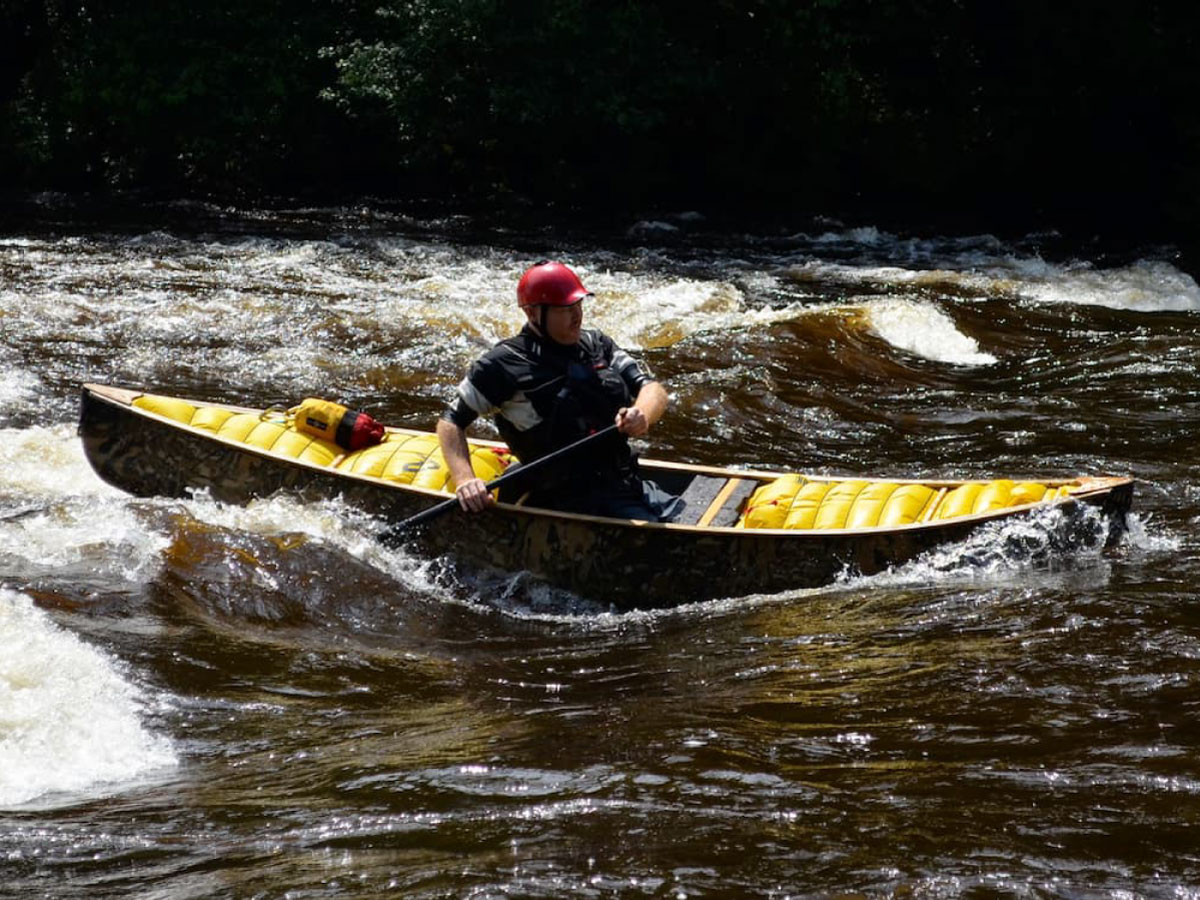 Canoeist running the rapids