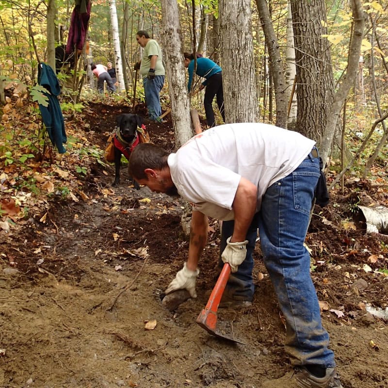 Volunteers working on a trail