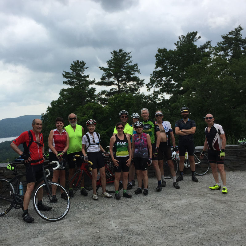 Cyclists pose for a photograph