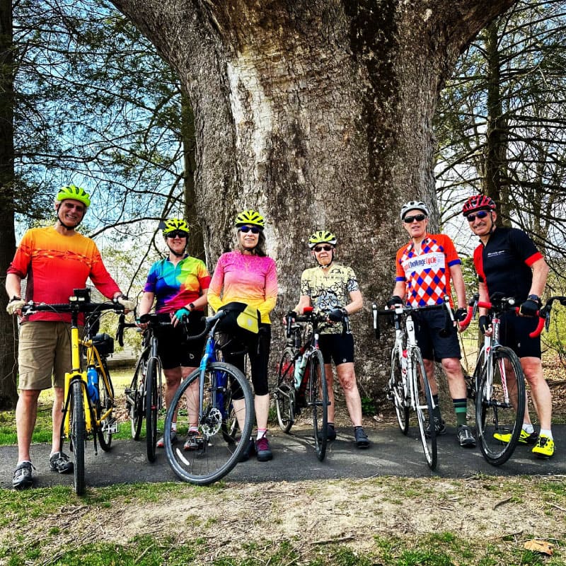 Cyclists pose for a photograph