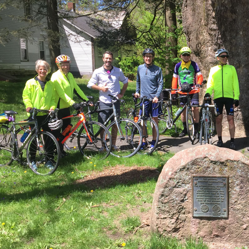 Cyclists pose for a photograph