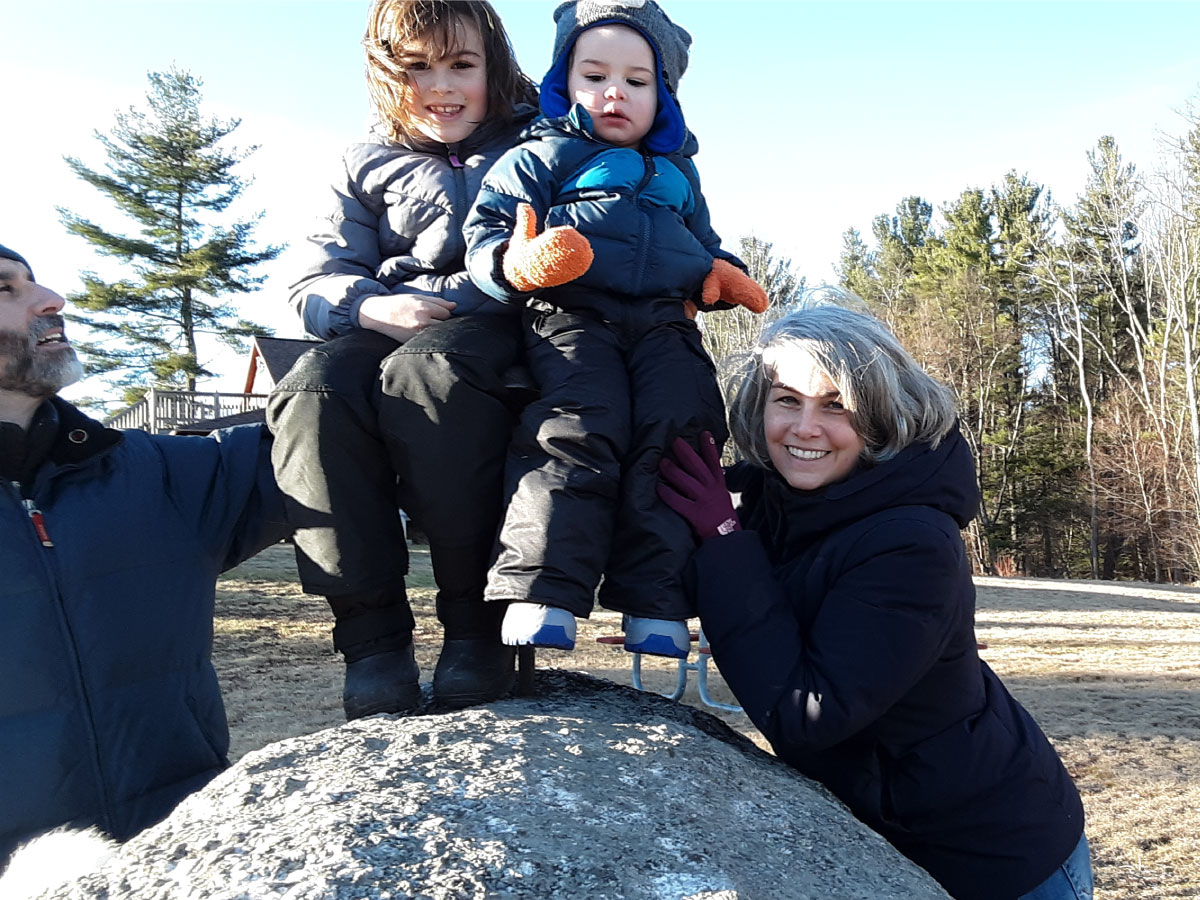 A family poses for a photograph at Noble View