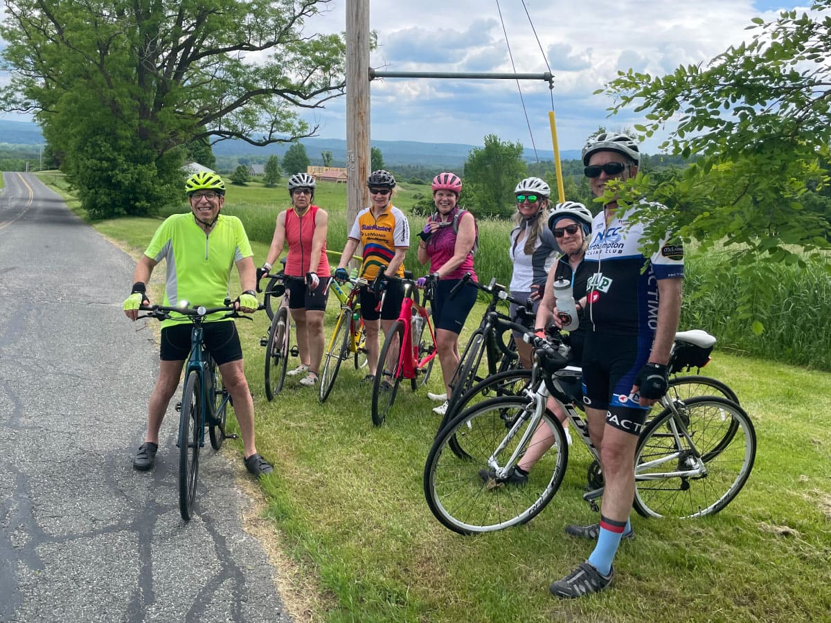 Cyclists pose for a group photograph