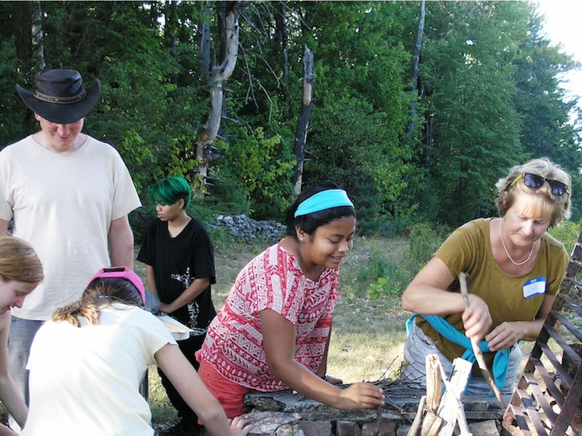 Members prep the campfire at FallFest