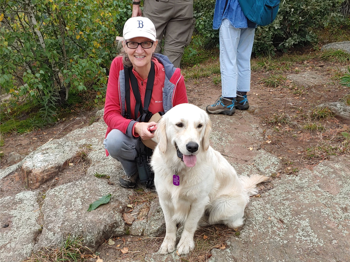 Hikers and a dog stop for a rest