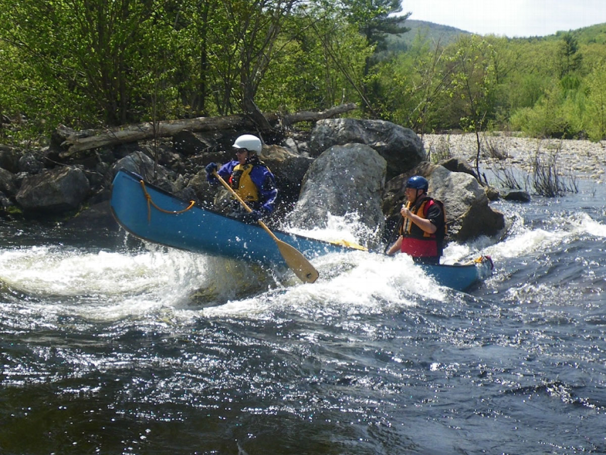 Canoeists run the rapids
