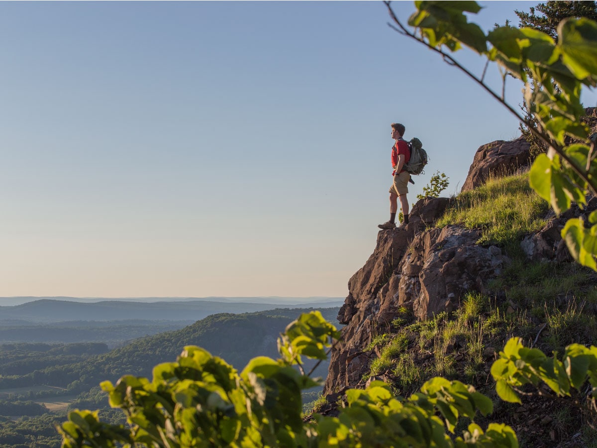 A hiker views the landscape from the NET