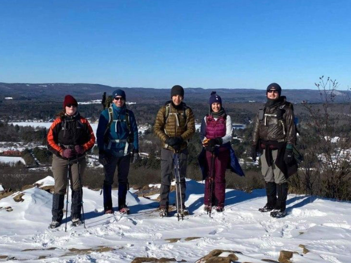 Members of the 20s & 30s Committee hiking in winter
