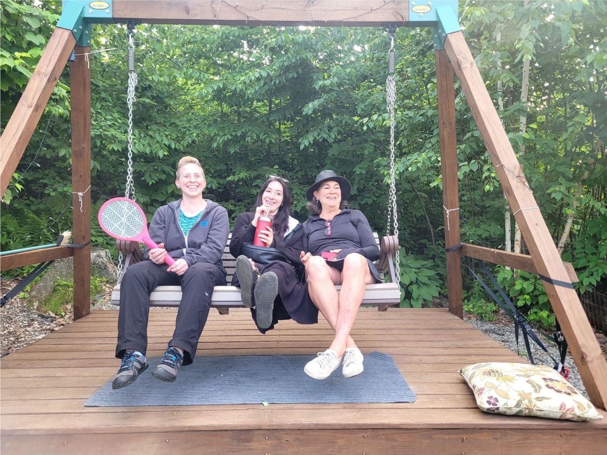 Three women on a swing