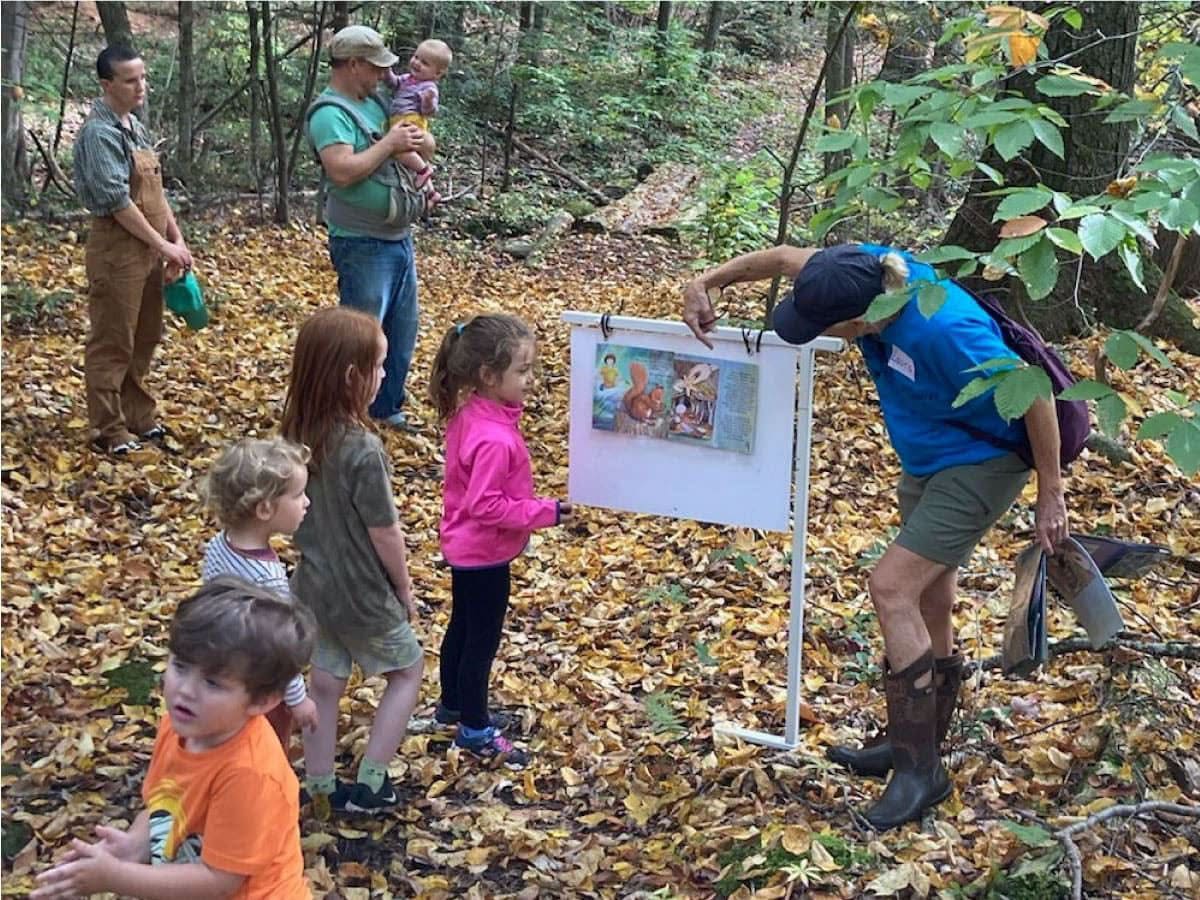 Teacher and children on a trail