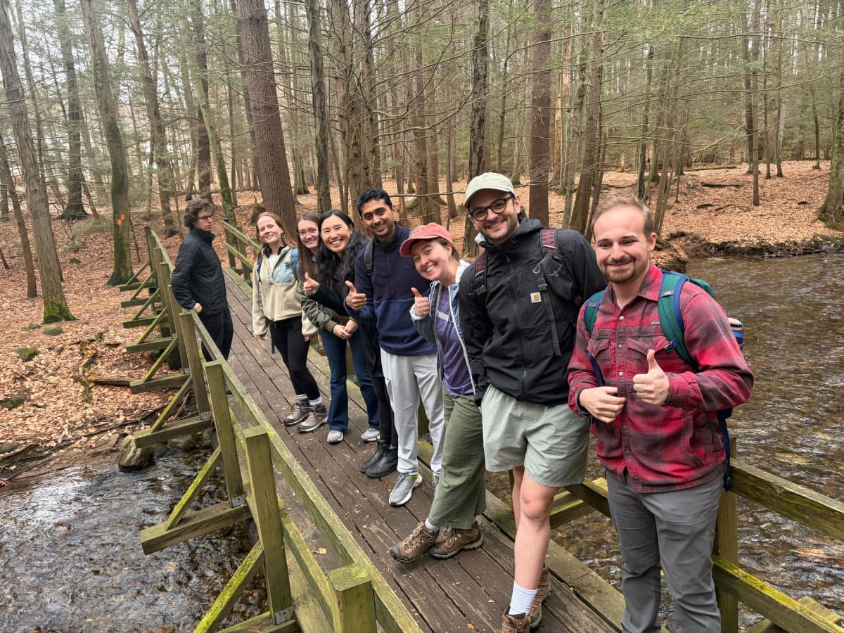 Hikers standing on a bridge