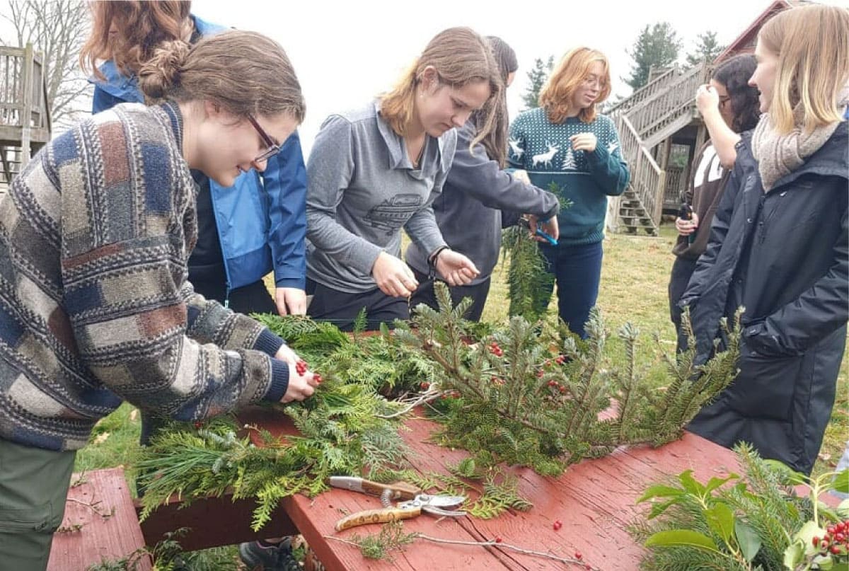 Workshop participants making holiday decorations
