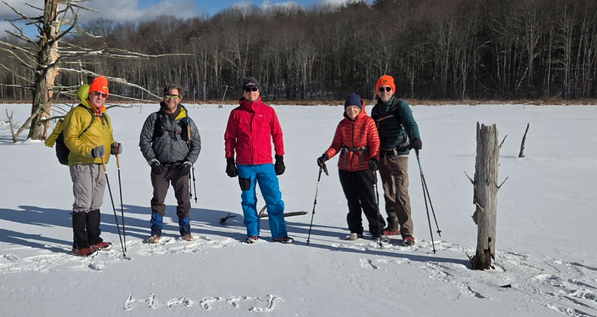 Hikers on a pond