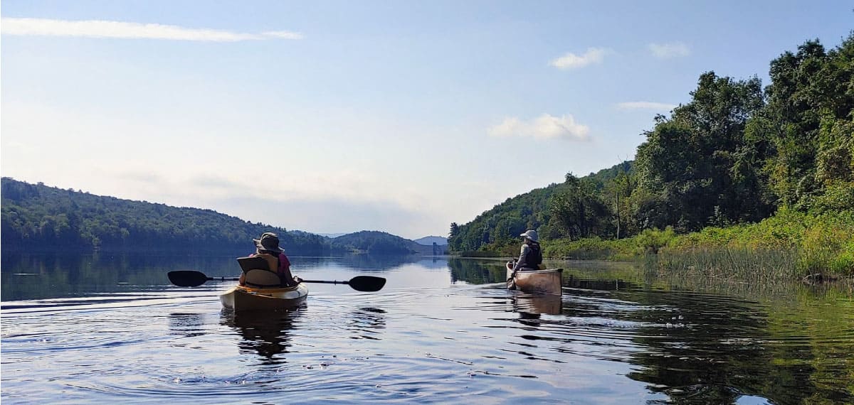 Canoeists on a quiet pond