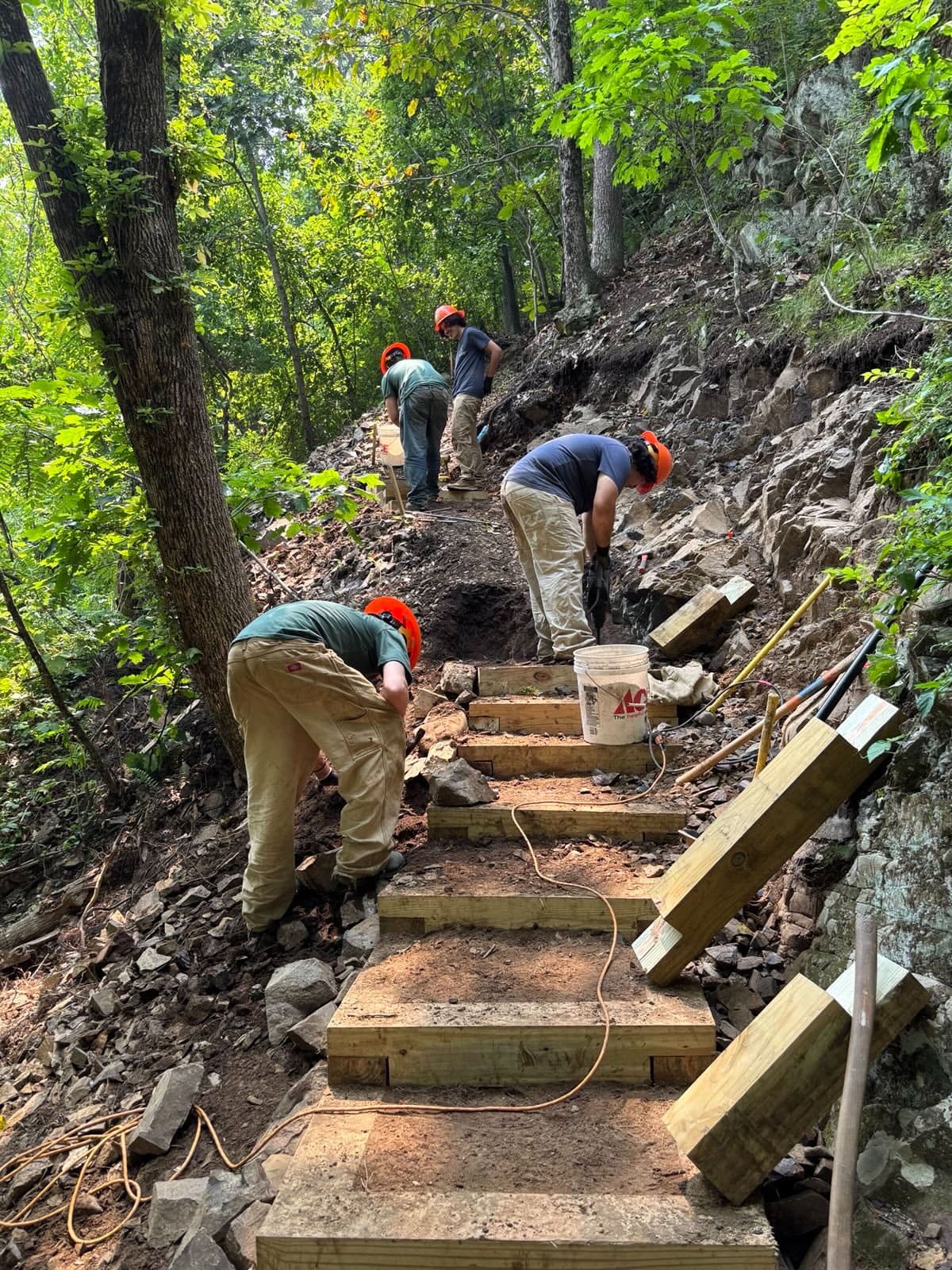 Workers building a staircase on a hiking trail