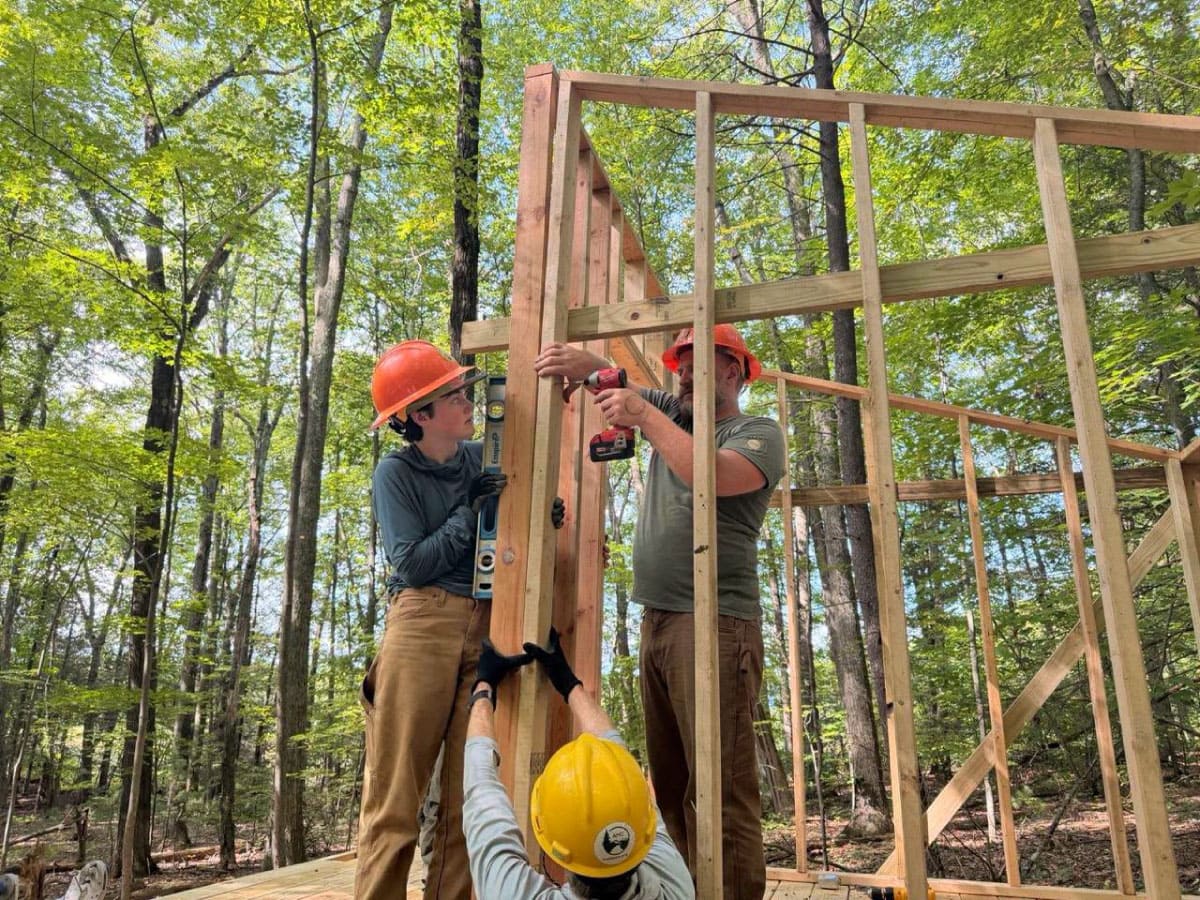 Workers building a privy