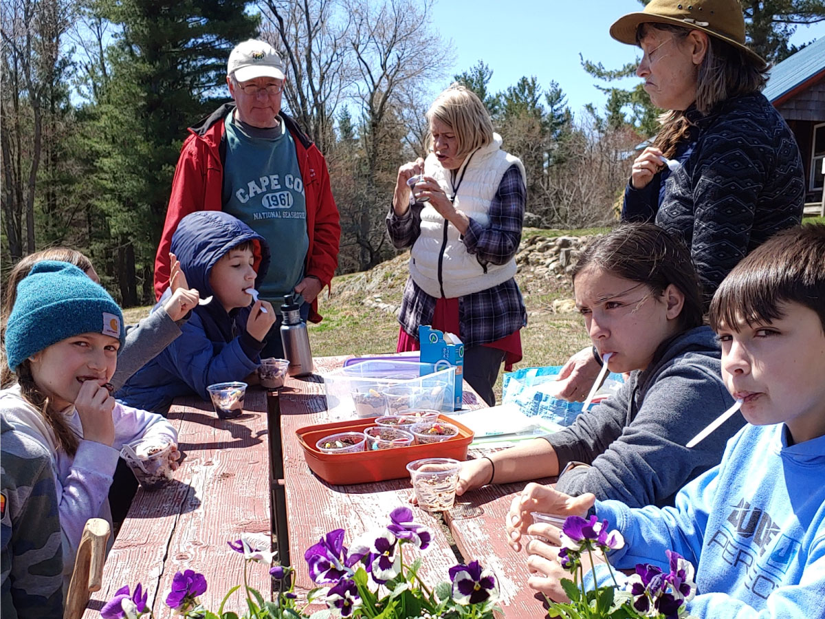 Families pot flowers at Noble View