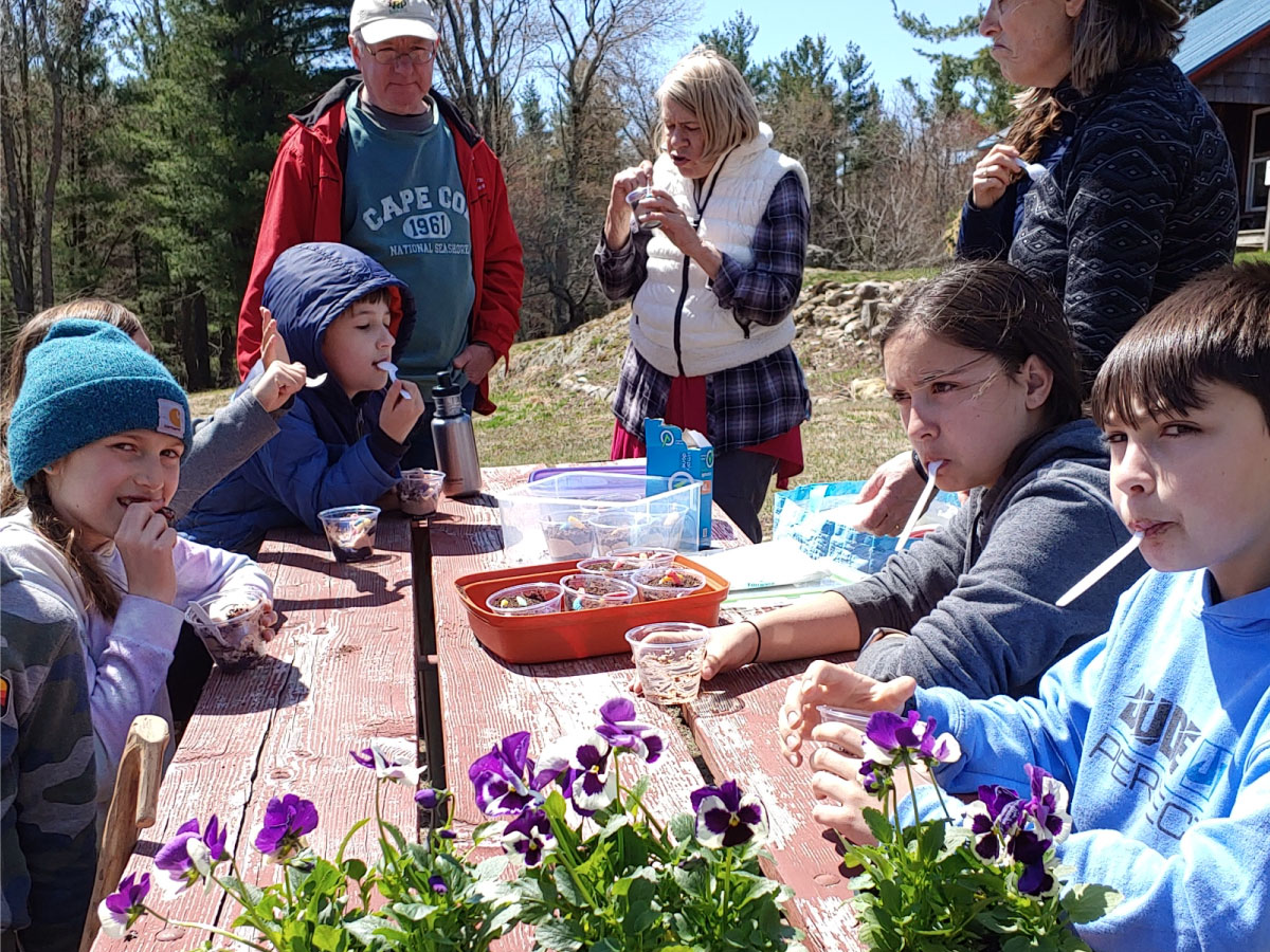 Children repotting flowers