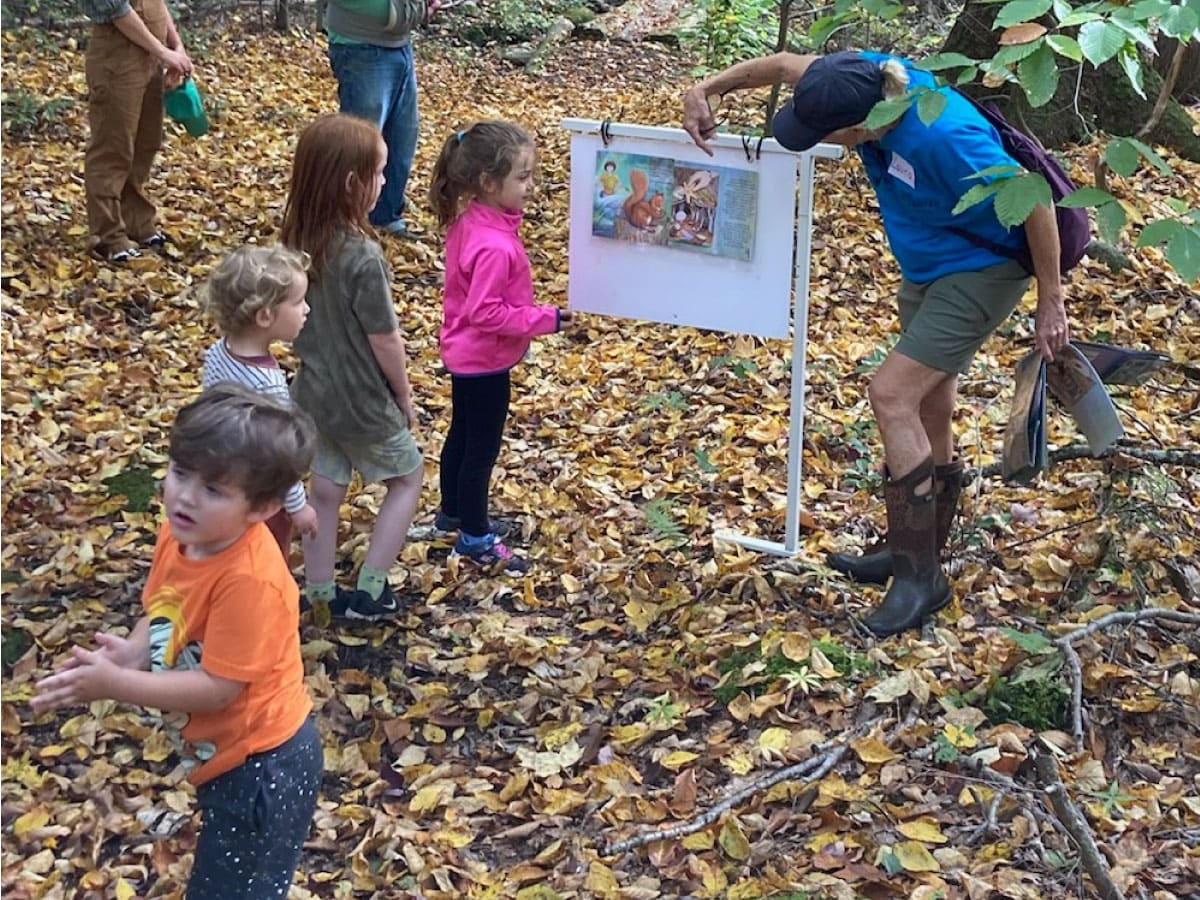 A teacher shows a story® sign to children