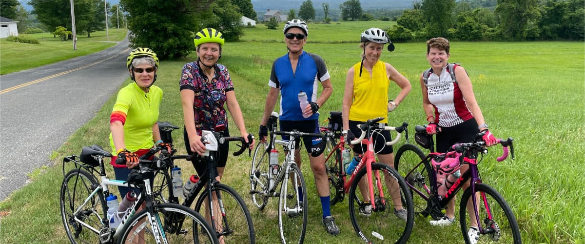 Cyclists pose for a photograph