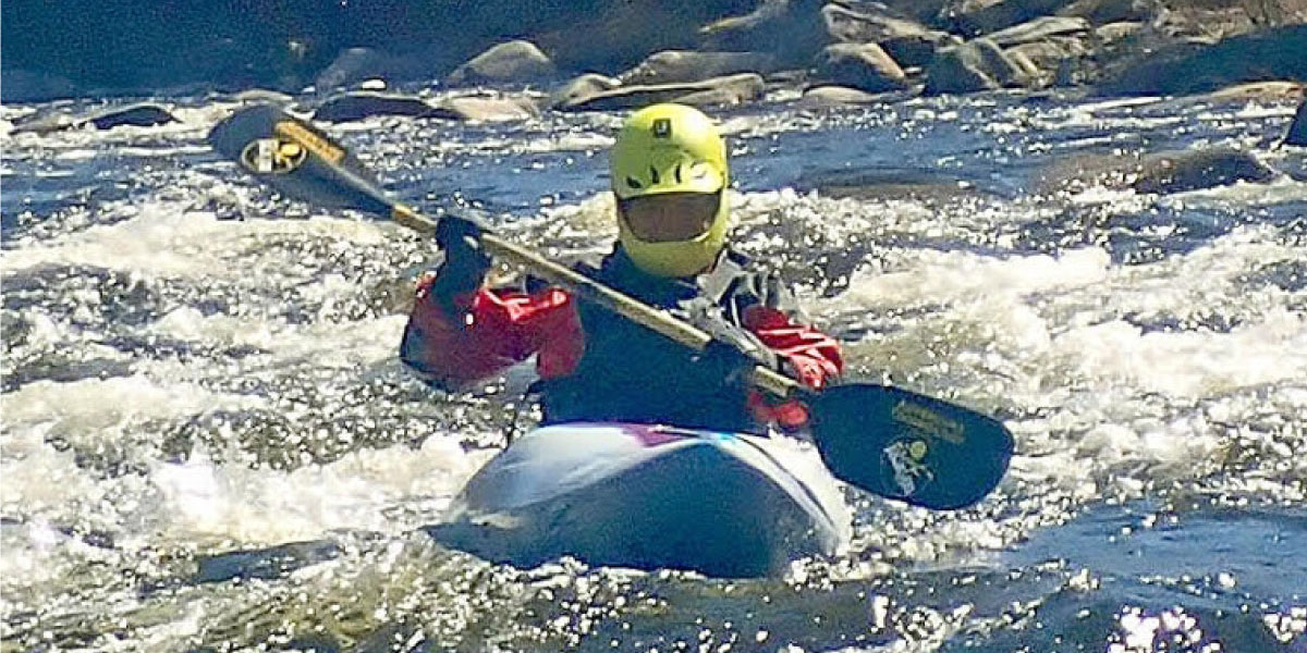A kayaker in whitewater
