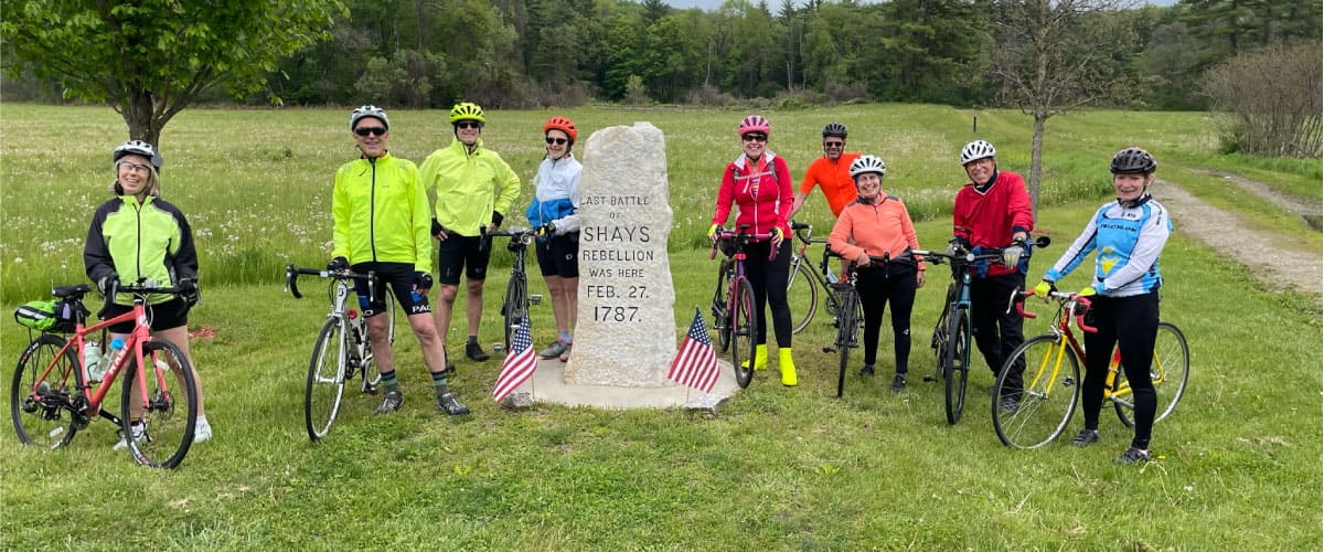 Cyclists pose for a photograph