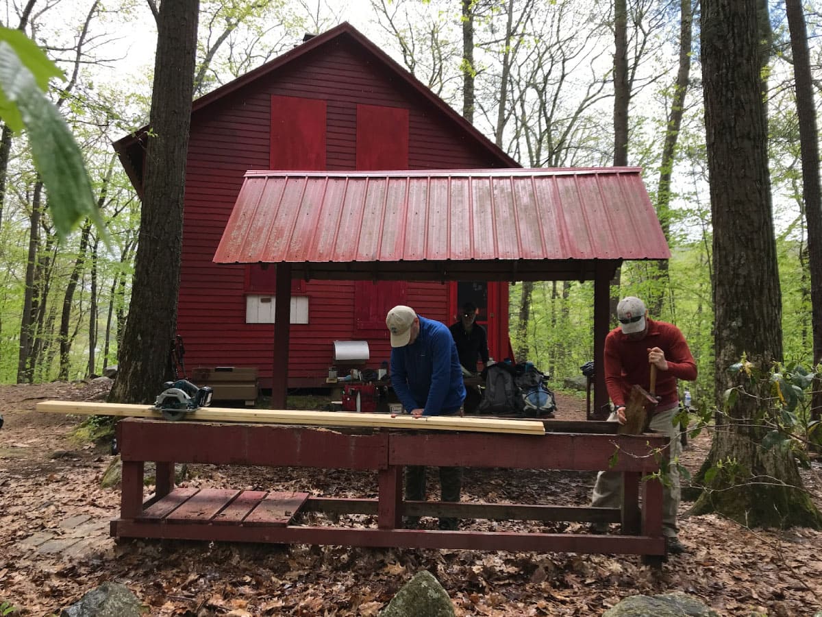 Rob Blosky and Carter Wilding-White repair the wash table at UGPC