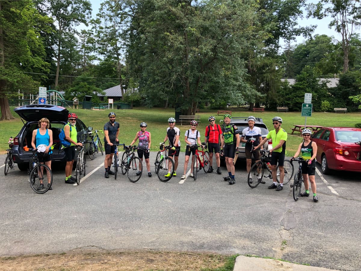 Cyclists pose for a photo