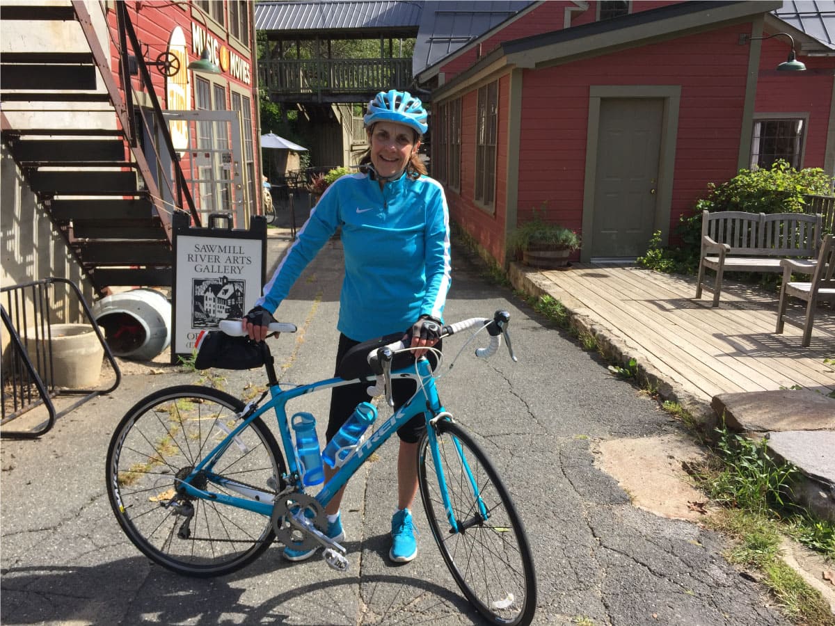 A cyclist poses for a photo