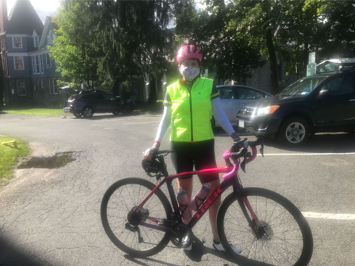 A cyclist poses for a photo