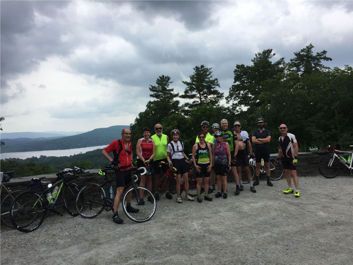 Cyclists pose for a photo