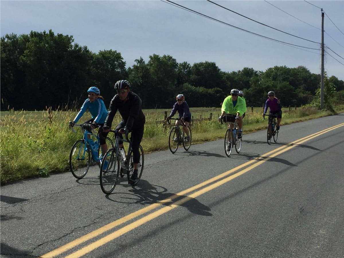Photo of cyclists riding their bikes 