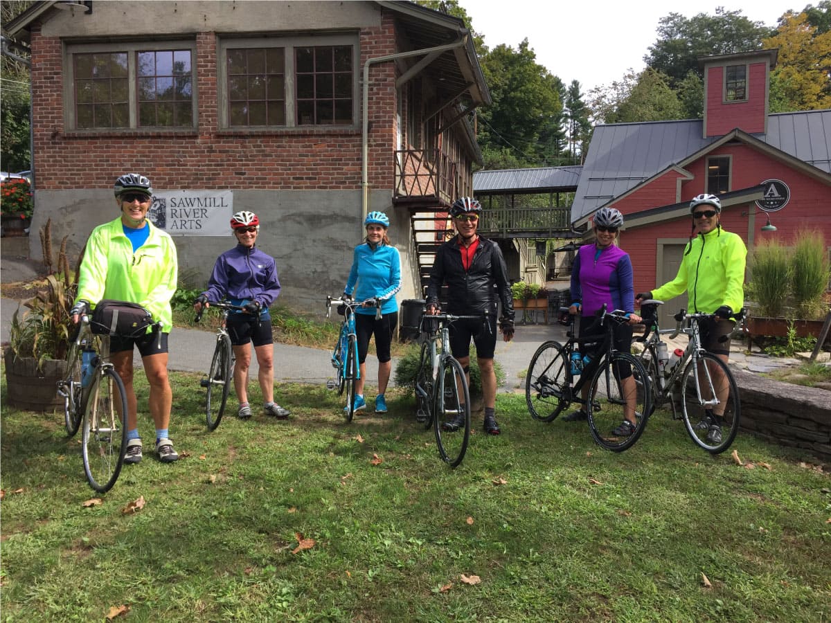Cyclists pose for a photo