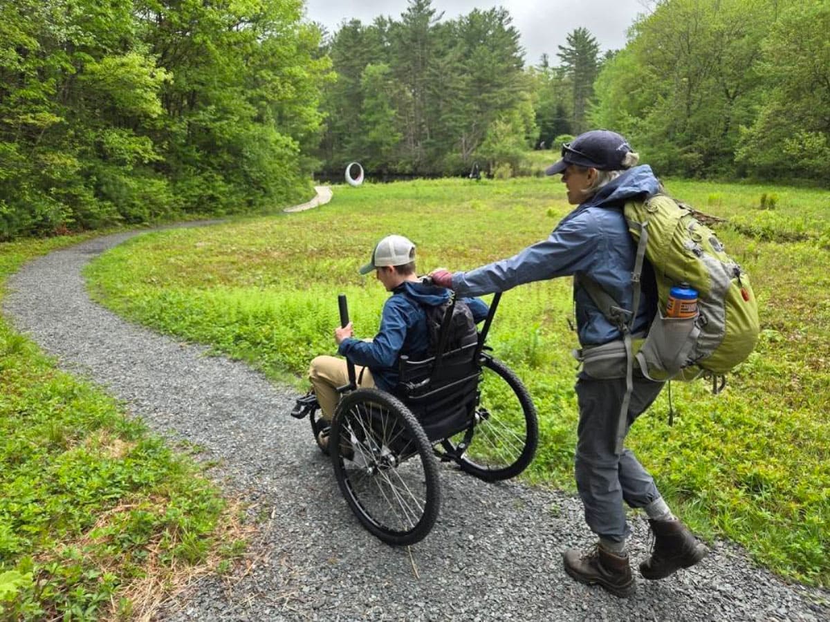 Wheelchair hiker on a gravel path