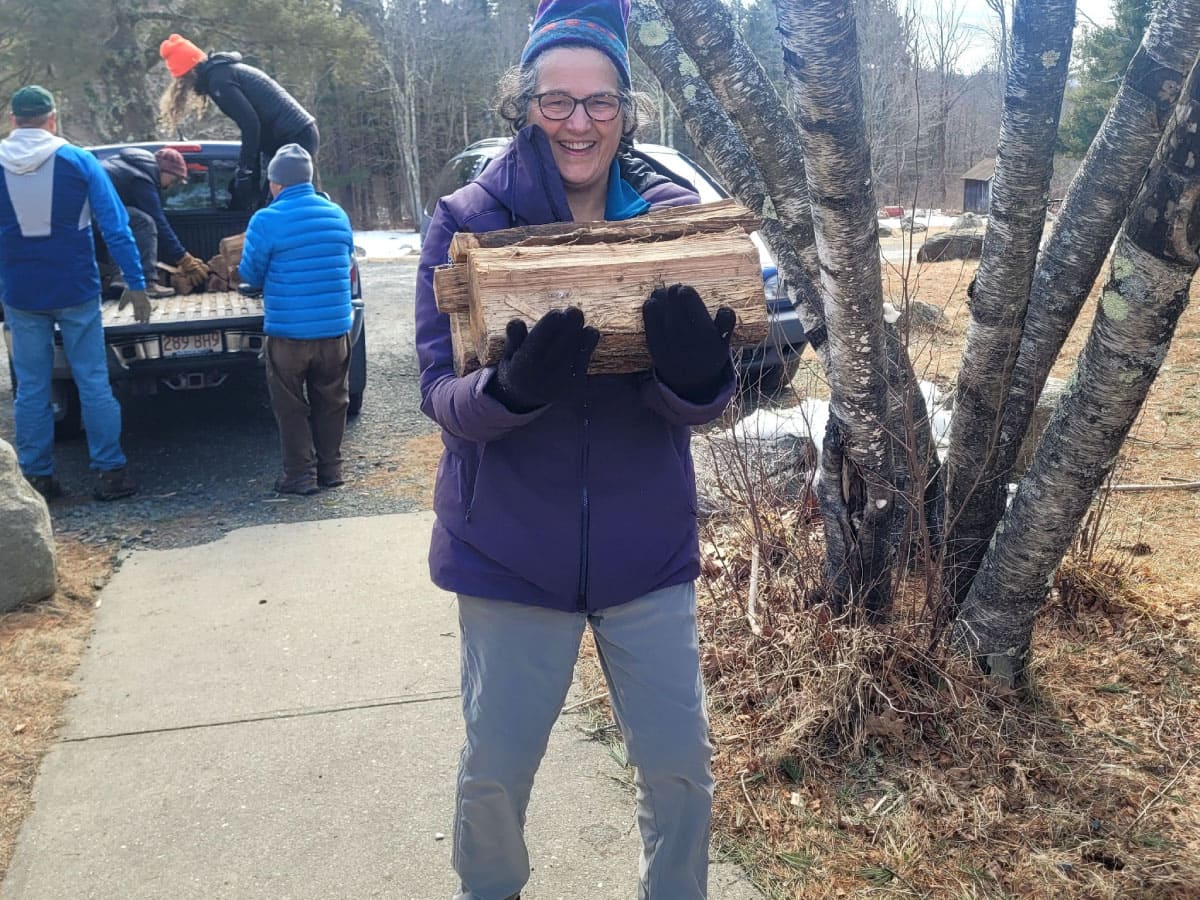 Woman carrying wood