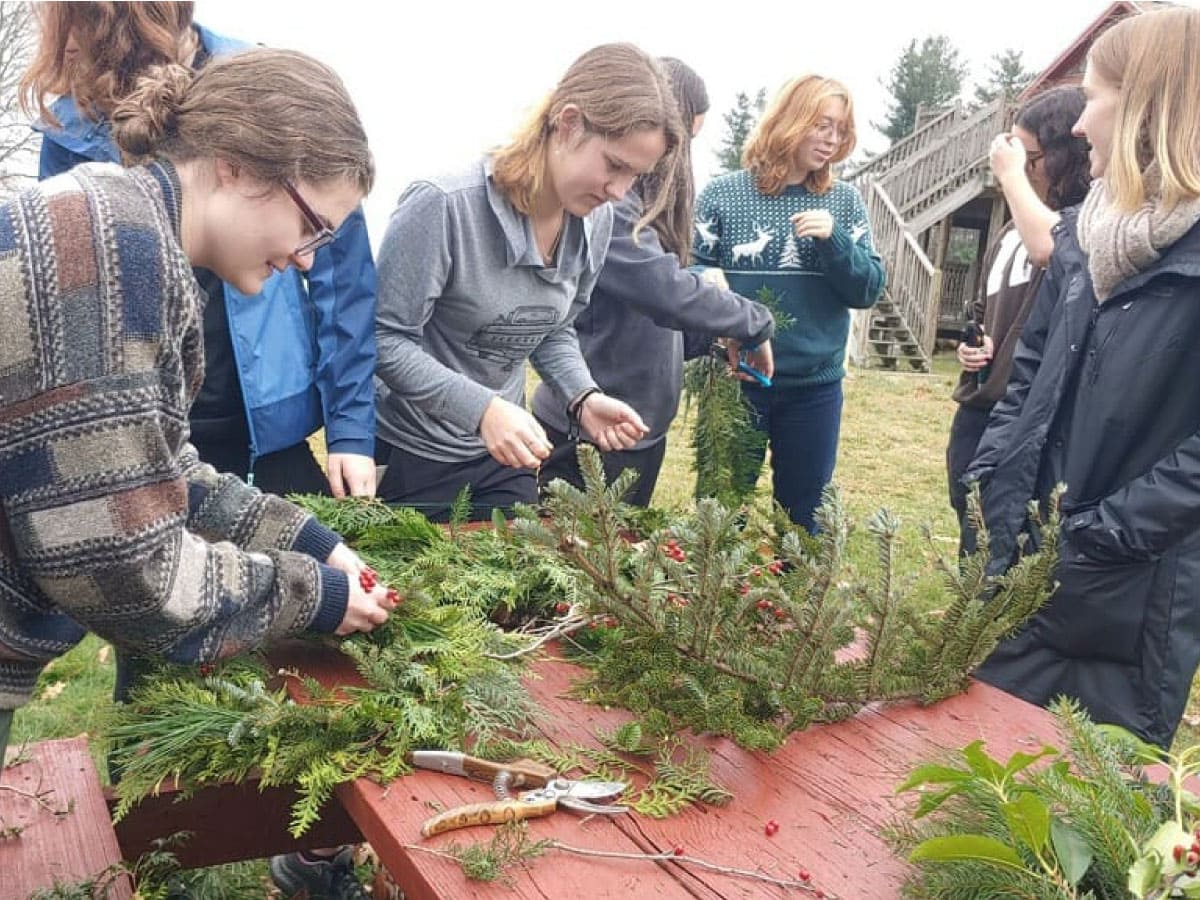 Workshop participants making holiday decorations