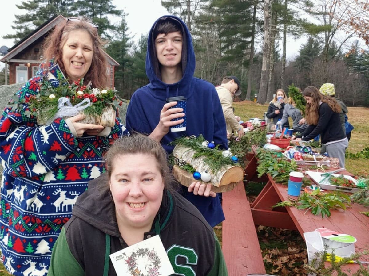 Workshop participants display their holiday decorations