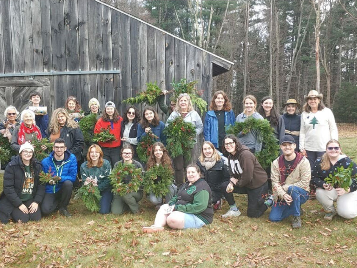 Workshop participants display their holiday decorations
