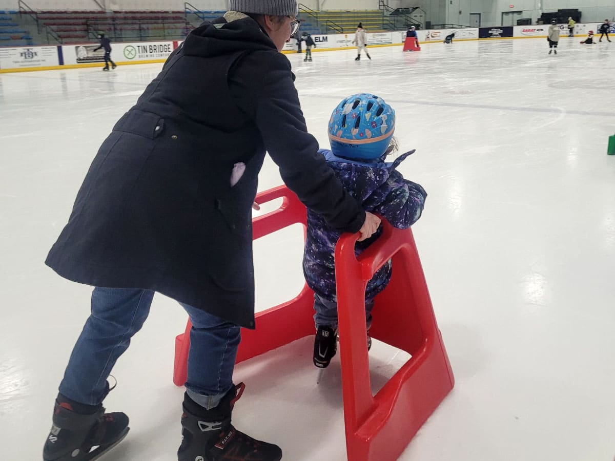 Parent and child ice skating