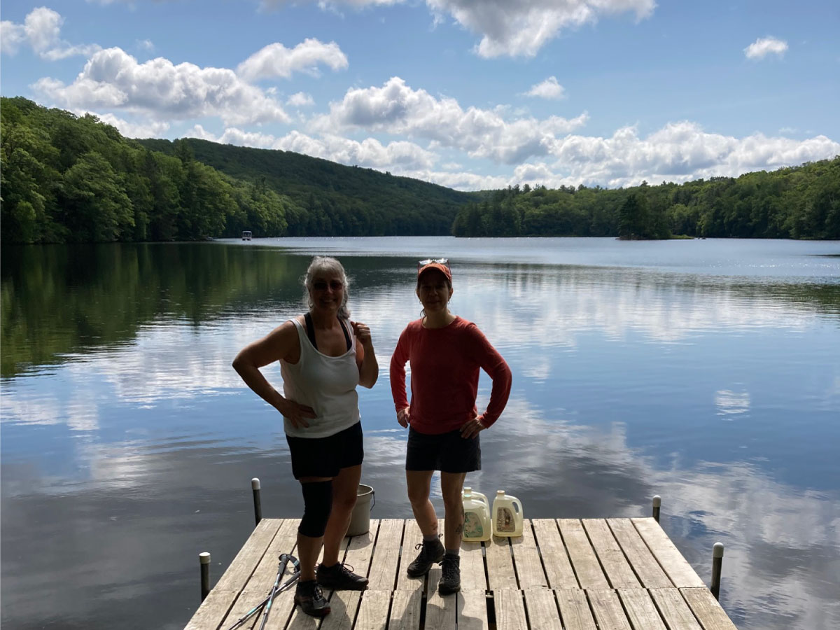 Hikers standing on a dock