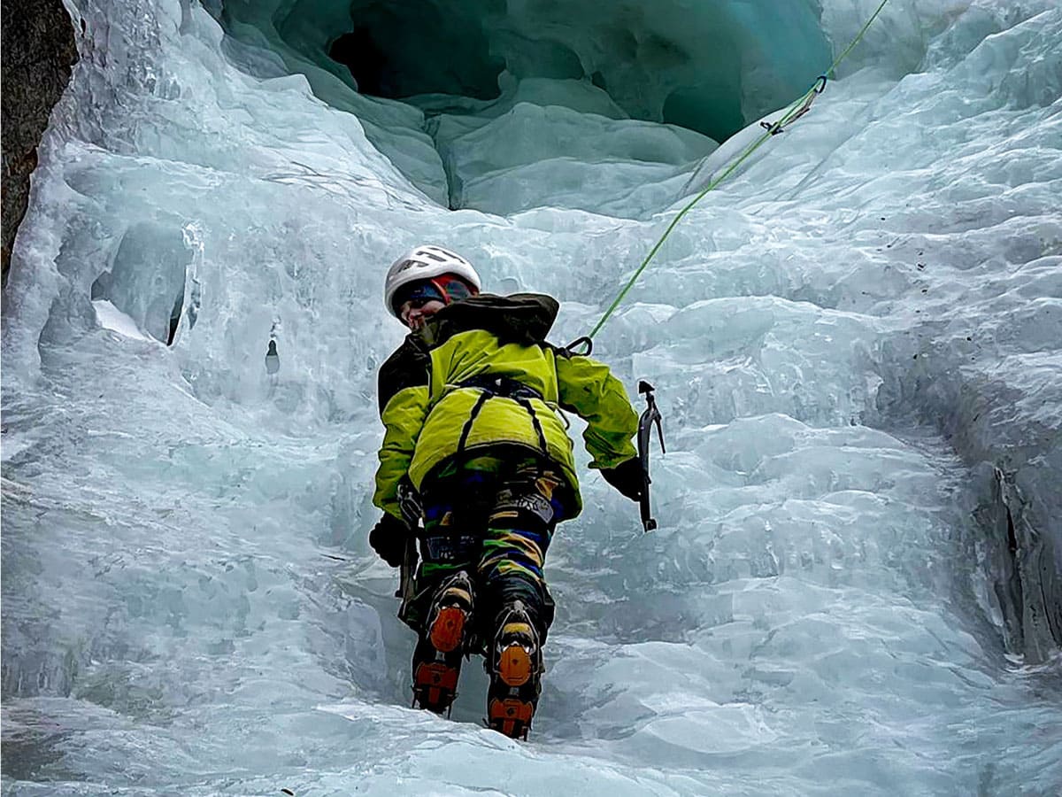 Woman ice climbing