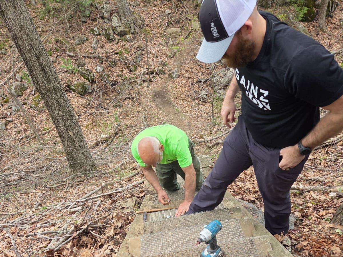 Volunteer trail workers repairing stairs
