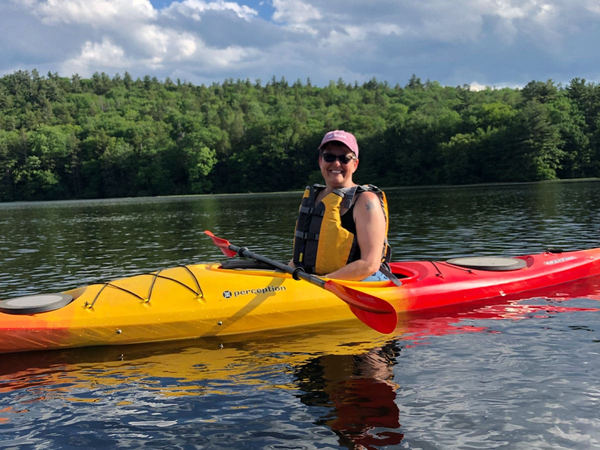 Woman kayaking on a lake