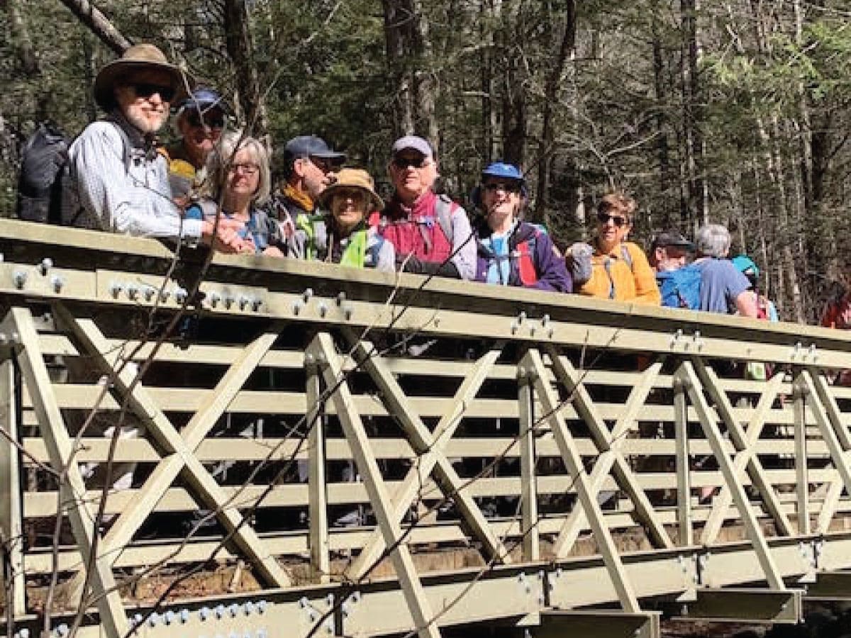 Hikers on a bridge