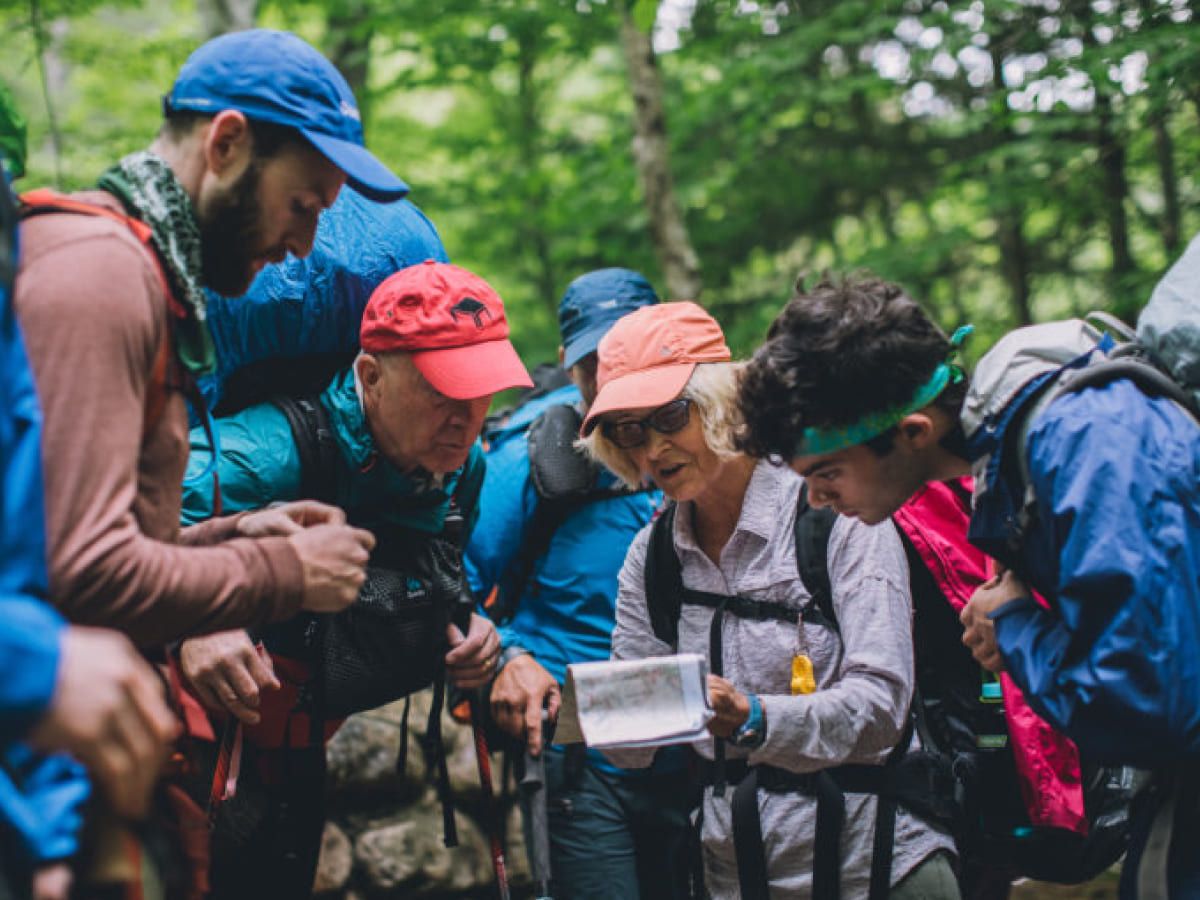 Group of volunteers interpret a map