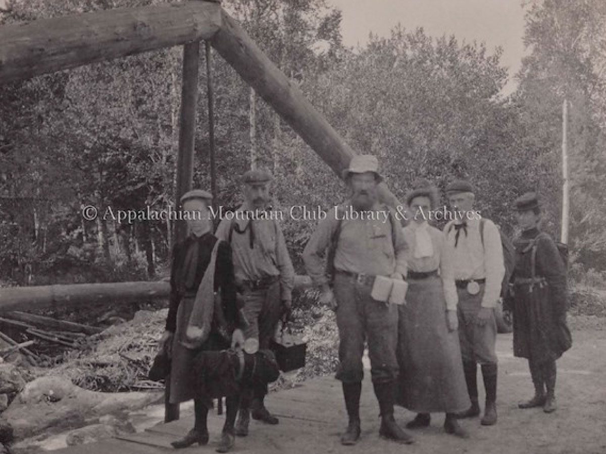 Hikers on a bridge