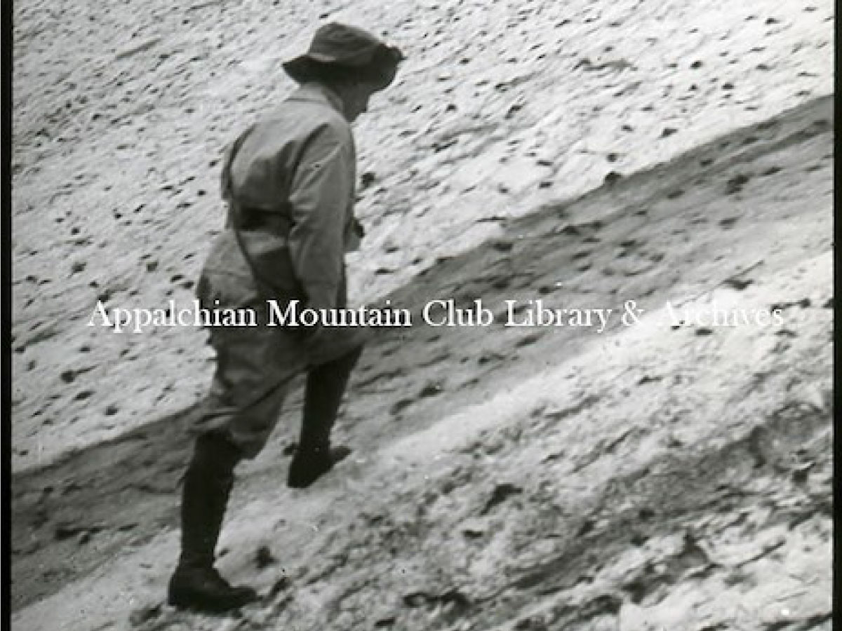 A woman climbing in snow